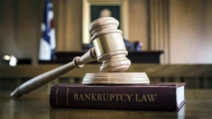 Gavel rests on a book titled Bankruptcy Law.